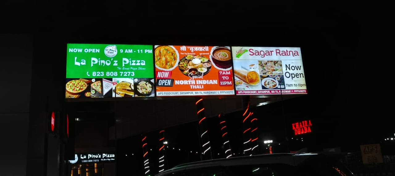 La Pino'z & Sagar Ratna Lit Highway Sign