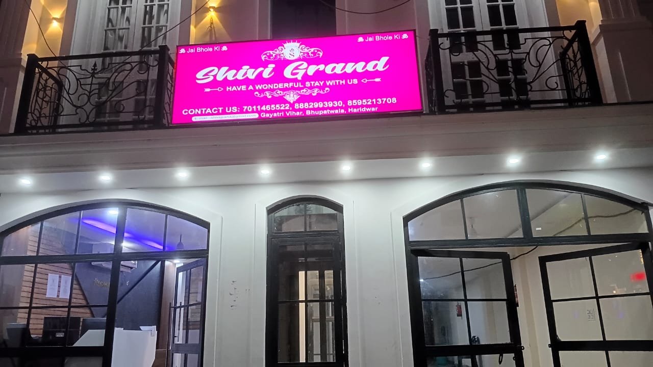 Shivi Grand Hotel Magenta Backlit Sign
